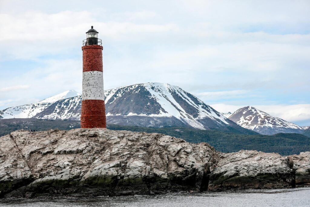 pexels-photo-3822470-3822470 Stunning view of Les Eclaireurs Lighthouse with snow-capped mountains in Ushuaia, Patagonia. VIA.AR