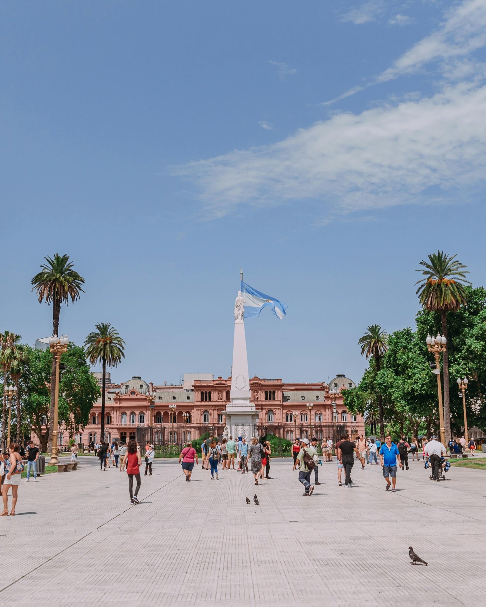 View of Plaza de Mayo with the iconic Casa Rosada and Argentine flag in Buenos Aires.